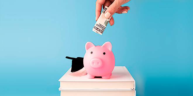 Financing and saving money on pink piggy bank